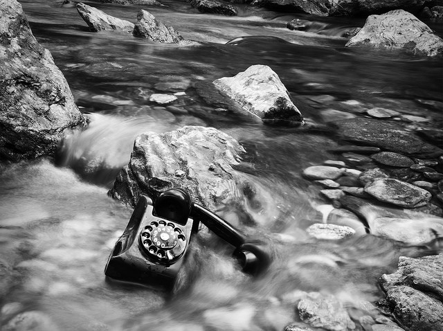 signs a client isn't engaging with you: phone in a stream