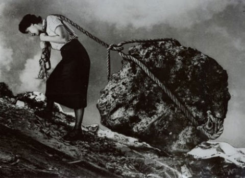 Us and them: how to bridge the gender communication gap: a woman pulling a large boulder uphill