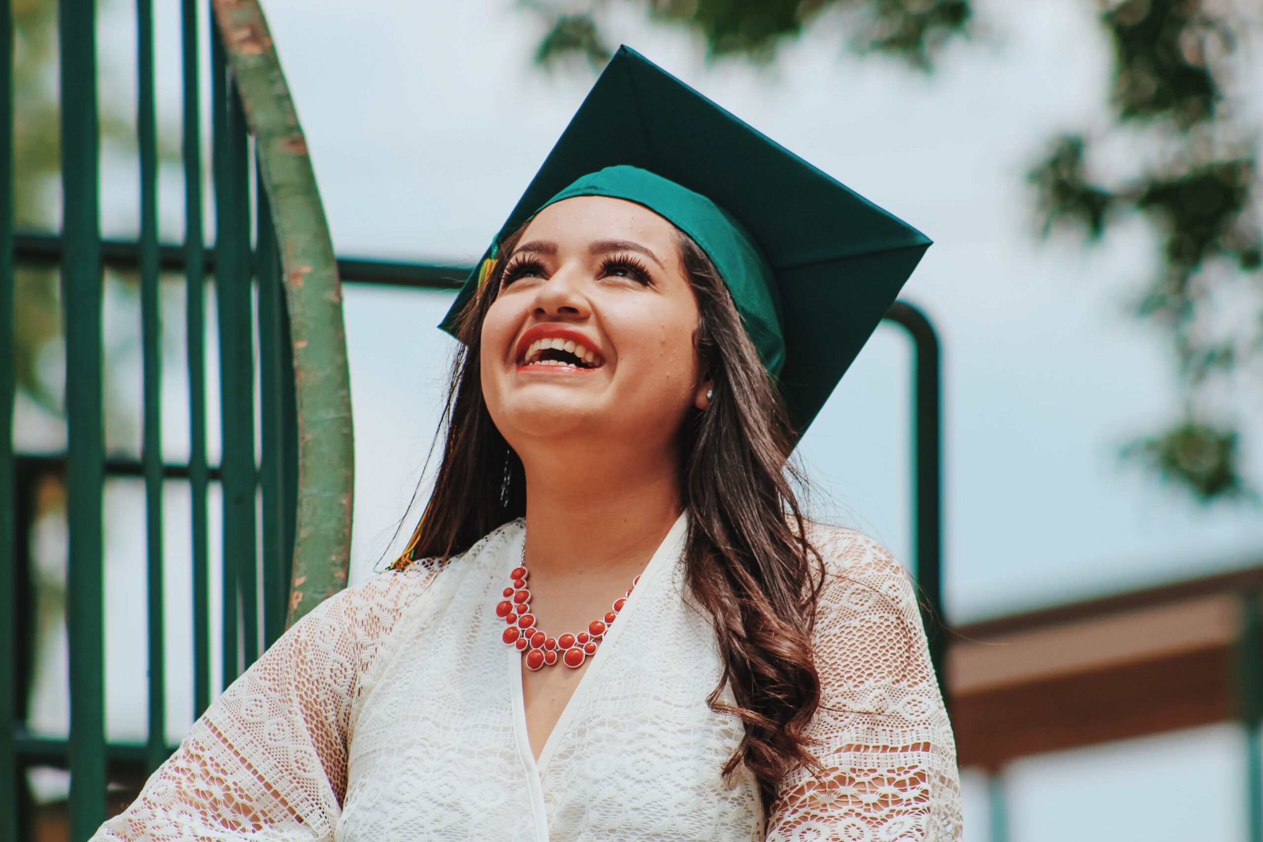 Leadership skills for women: a woman smiling at graduation