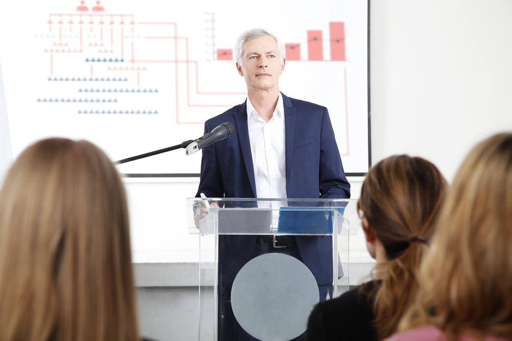 IPO presentations: man at podium with charts
